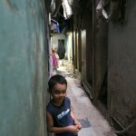 Boy in a narrow street in Dharavi