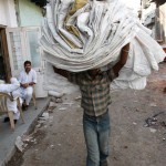 Ragpicker carrying recycled bags